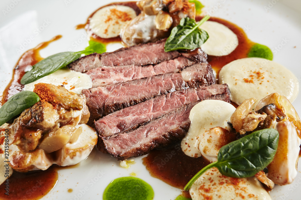 Restaurant Plate of Black Angus Beef Fillet with Warm Potatoes in Cheese Sauce and Mushroom Espuma Restaurant Plate of Black Angus Beef Fillet with Warm Potatoes in Cheese Sauce and Mushroom Espuma