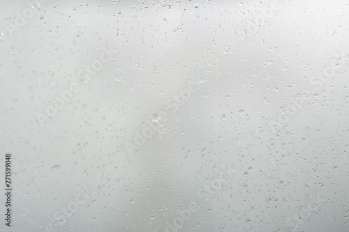 wet glass background condensate / abstract rain, drops texture on transparent glass