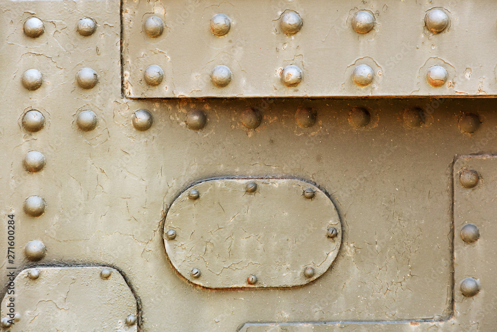 Φωτογραφία steam punk metal background. real tank metal plates of armor