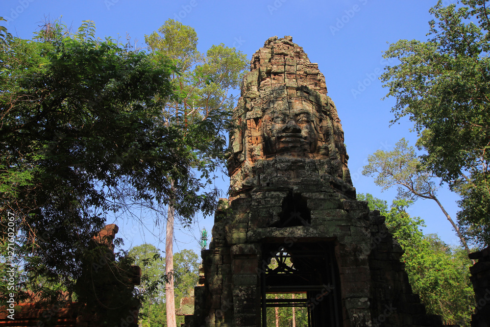 Ancient stone faces of gates on Bayon temple, Angkor Wat, Siam Reap, Cambodia Ancient stone faces of gates on Bayon temple, Angkor Wat, Siam Reap, Cambodia