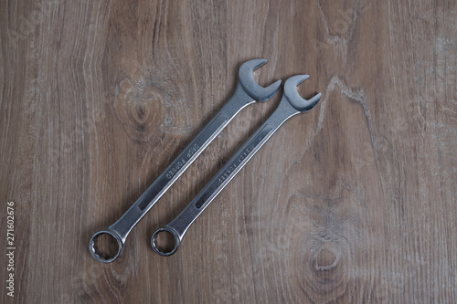 Set of wrenches studio image. Tool old wrenches on wooden background.