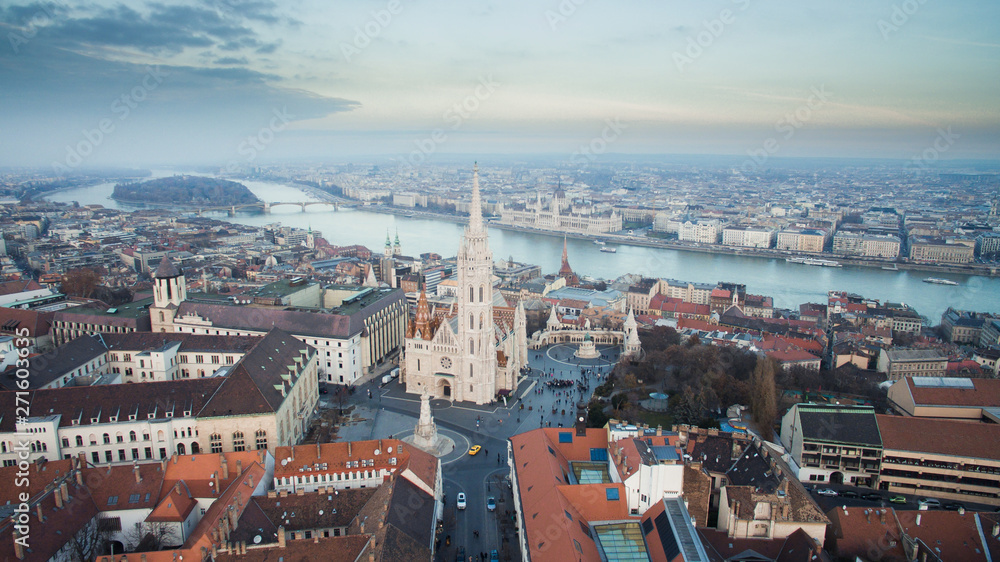 Aerial skyline view of Matthias Church with Danube River and Parliament. Beautiful sunny day at Budapest, Hungary, Europe.