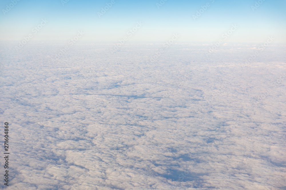 Fluffy clouds at the morning from the aircraft