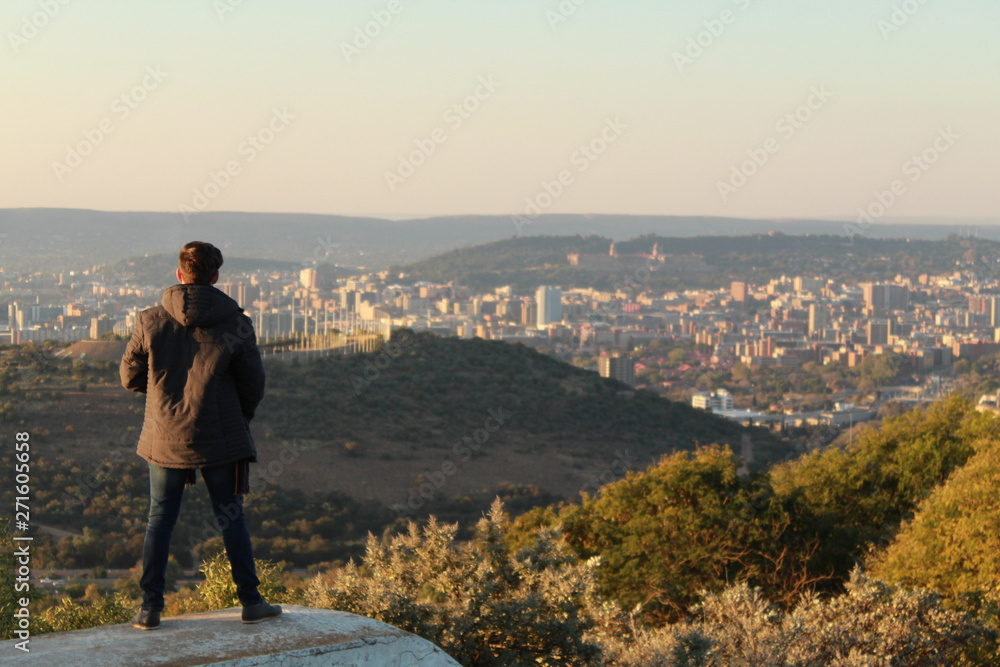 man looking at sunset man looking at sunset