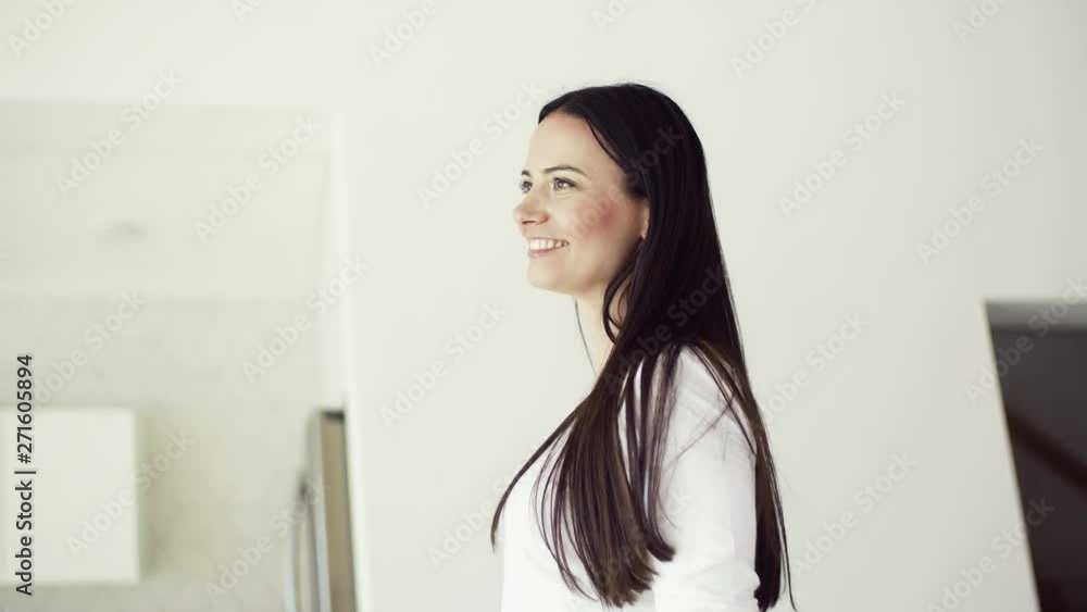 An excited young woman in new home, spinning. An excited young woman in new home, spinning.