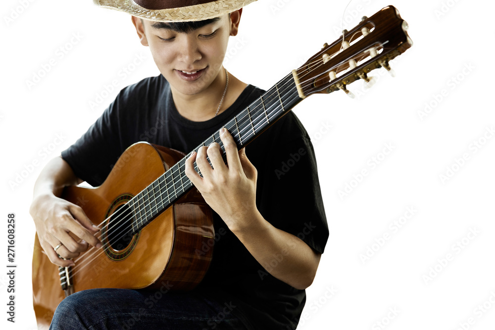 Obraz premium Asian man playing classic guitar isolated on white background in high contrast.