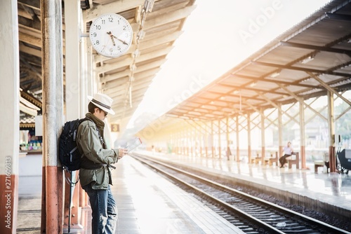 Travel man wait train at platform - people vacation lifestyle activities at train station transportation concept © pairhandmade