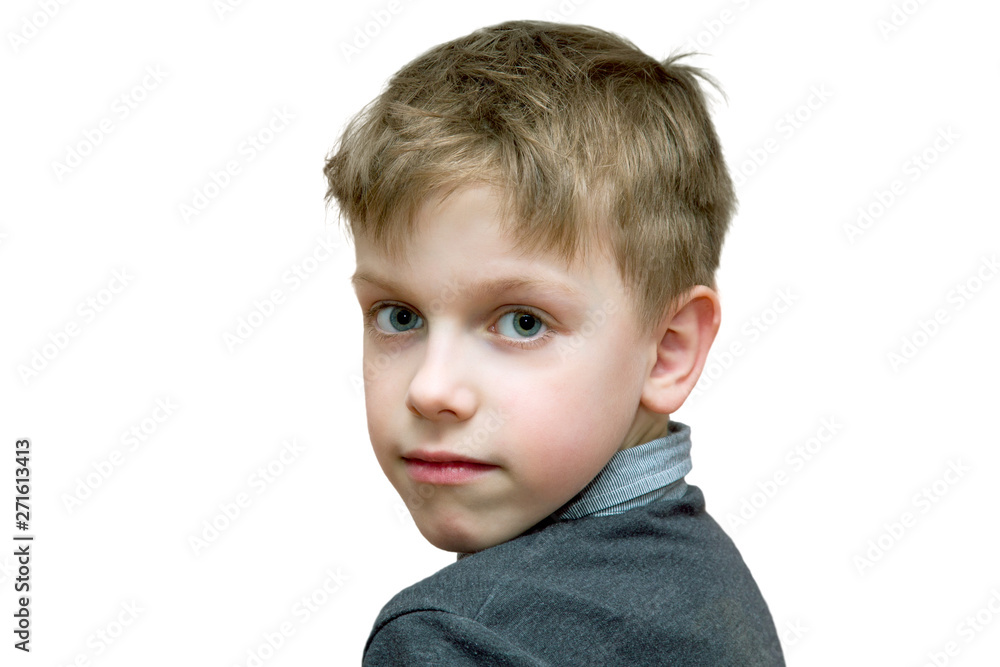 the boy looks half-turned right into the camera on a white background the boy looks half-turned right into the camera on a white background