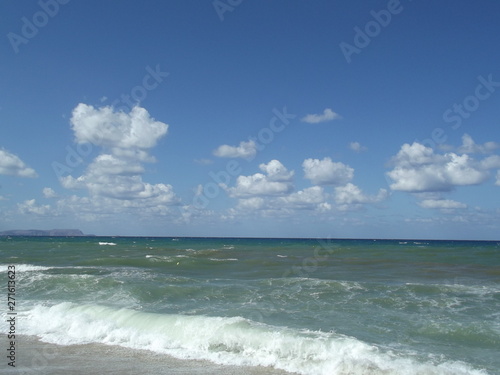 sea and blue sky with clouds