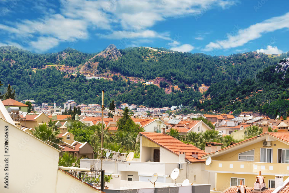 View of Marmaris from above, the roofs of houses from the tiles and the mountains. Turkey