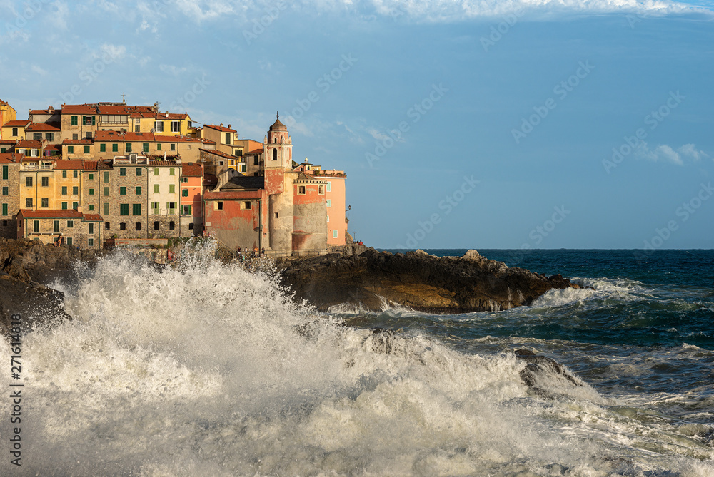 Big waves in the Mediterranean sea. The ancient village of Tellaro during a sea storm. La Spezia, Liguria, Italy, Europe