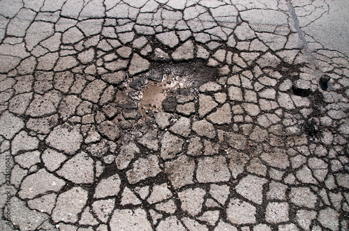 broken broken asphalt cracks potholes