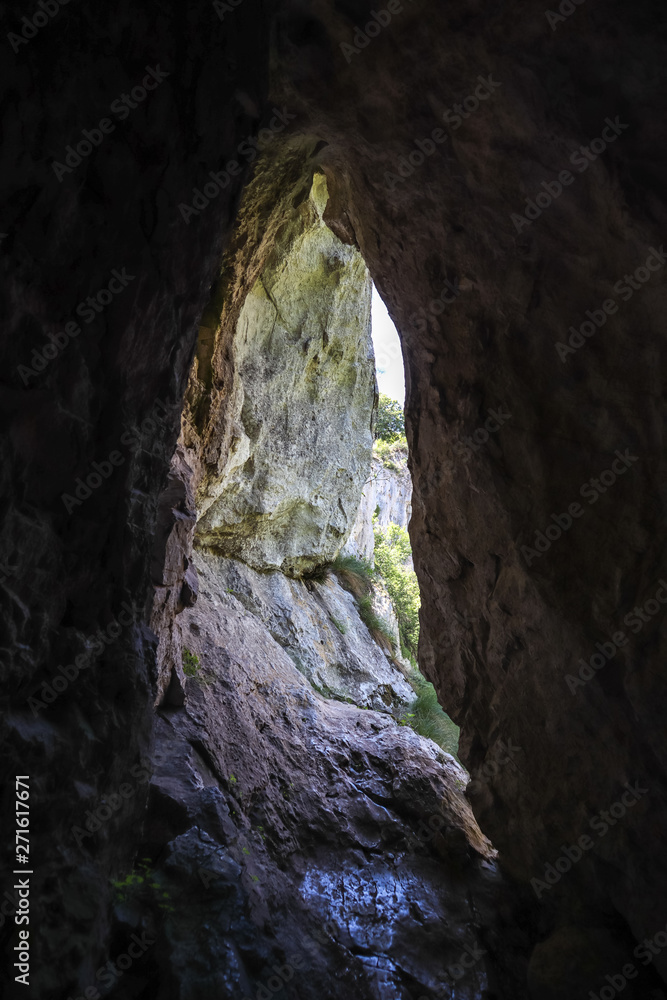 Hole or cave in stone by the Vratna river in Serbia