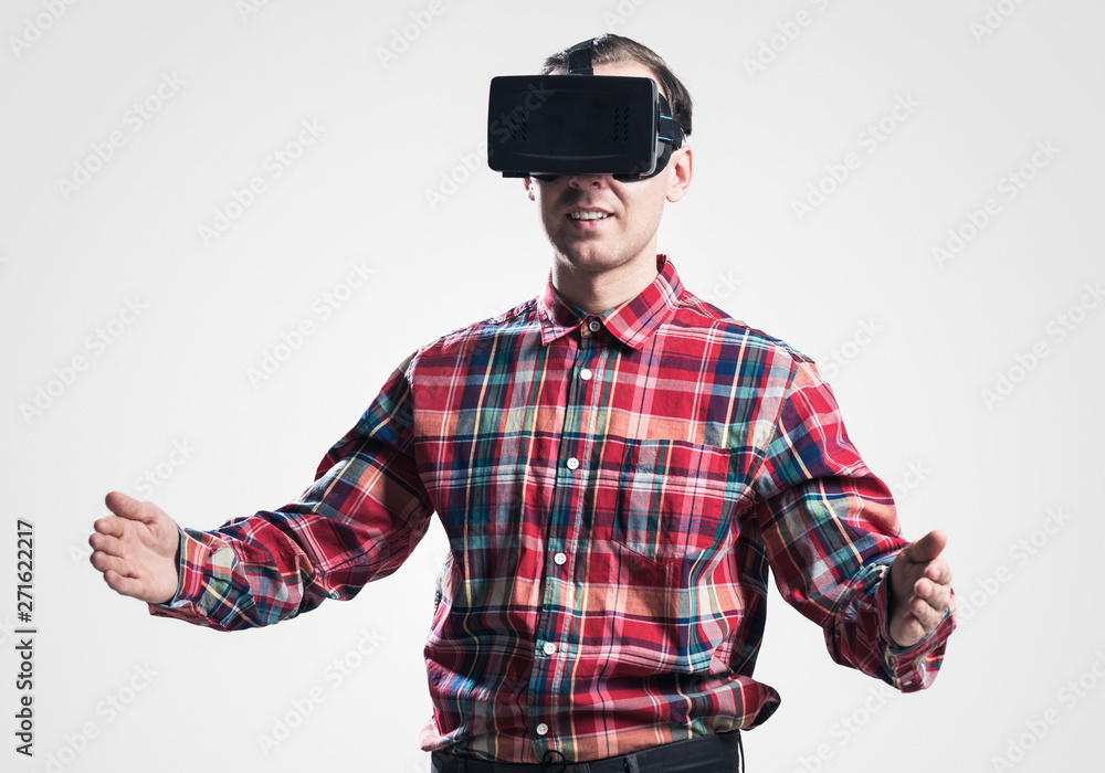 Guy in mask experiencing virtual reality as new entertainment device Guy in mask experiencing virtual reality as new entertainment device
