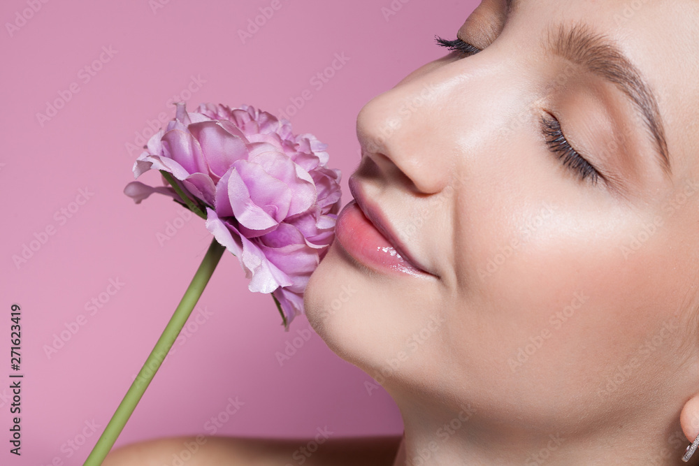 Young beautiful woman with flower on pink background. Young beautiful woman with flower on pink background.