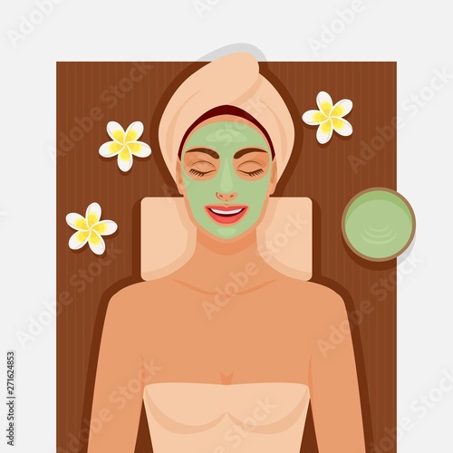 Spa therapy. Girl with green facial mask