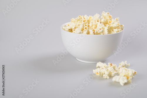 Bowl of popcorn isolated on white background.