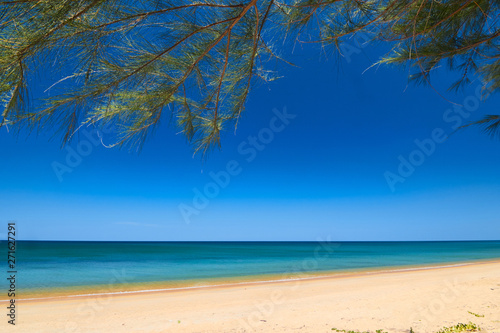 Beautiful and peaceful beach with clear water under the blue sky
