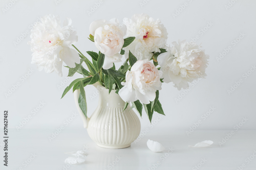 peonies flowers in vase on white background - obrazy, fototapety, plakaty 