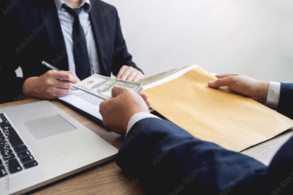 bribe and corruption concept, Corrupted businessman sealing the deal hand receiving venality bribe money from partner bribe and corruption concept, Corrupted businessman sealing the deal hand receiving venality bribe money from partner