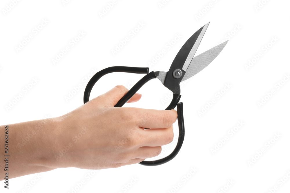 Woman holding scissors on white background, closeup Woman holding scissors on white background, closeup