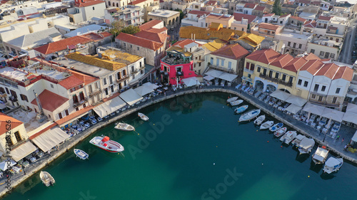 Aerial drone photo of unique old picturesque Venetian port with old lighthouse in the heart of famous city of Rethymno, Crete island, Greece