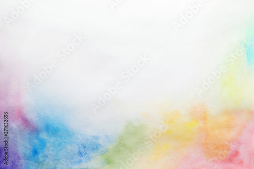 Colorful paints on white paper. Abstract background