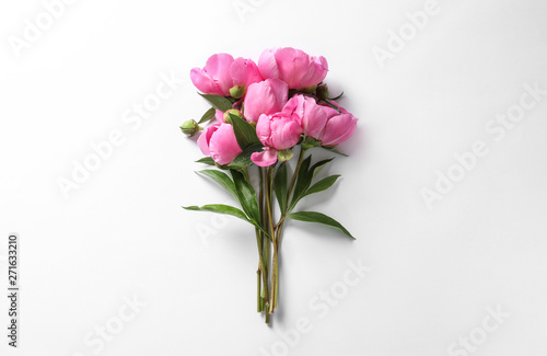 Fototapeta Naklejka Na Ścianę i Meble -  Fragrant peonies on white background, top view. Beautiful spring flowers