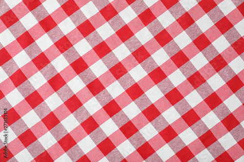 Checkered picnic tablecloth as background, top view