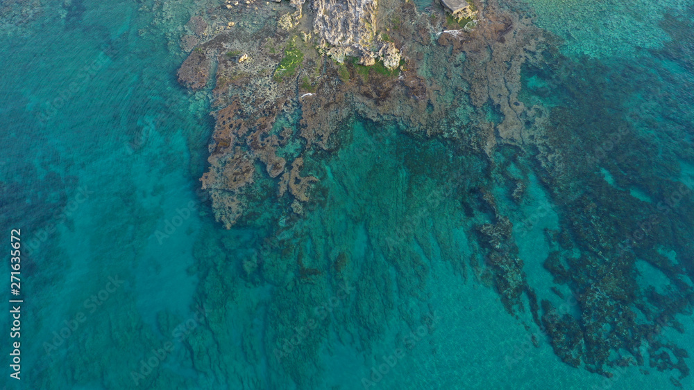 Fototapeta premium Aerial drone photo of unique old picturesque Venetian port with old lighthouse in the heart of famous city of Rethymno, Crete island, Greece