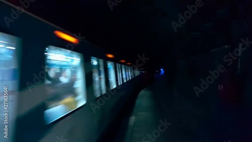 View of dark subway tunnel. Fast underground train passing. 4k Resolution photo