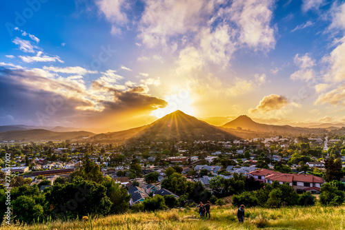 Sunset over Mountain Peak and City