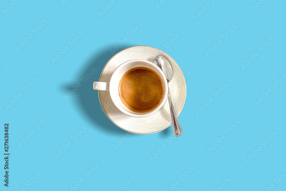 minimalist pattern with a top view of a coffee cup on a light blue pastel table minimalist pattern with a top view of a coffee cup on a light blue pastel table