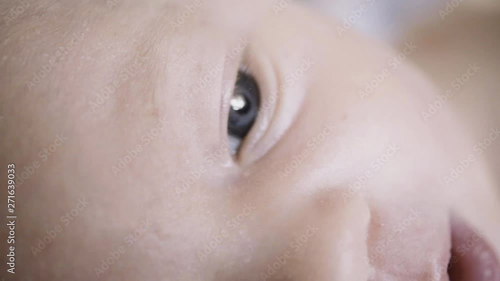 baby face close up looking at camera. baby face close up looking at camera.