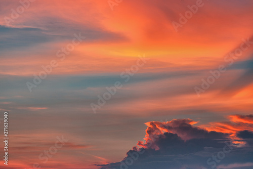 Sunset sky with red and dark clouds
