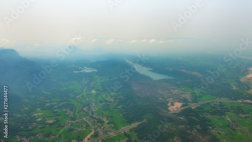 High view of green landscape with mountain,river and some route.