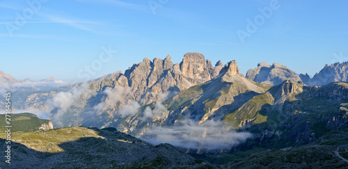 Italy, Dolomites, Bozen Province, the mountains Schwalbenkofel, Grosser Rautkofel, Schwabenalpenkopf, Birkenkofel, Hochebenkofel at early morning photo