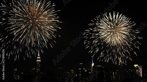 Night time fireworks over New York City skyline, wide