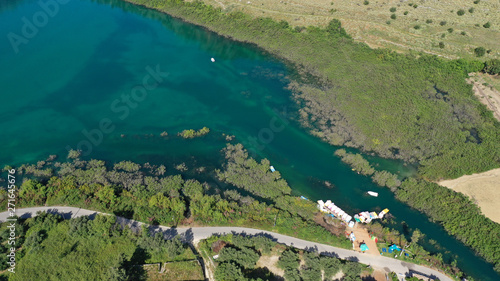 Aerial drone panoramic photo of famous natural lake of Kournas with amazing colours and unique nature surrounded by mountains, Chania prefecture, Crete island, Greece