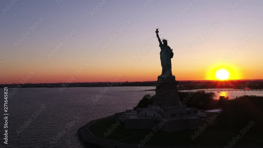 Panning aerial, sunset over Statue of Liberty Panning aerial, sunset over Statue of Liberty