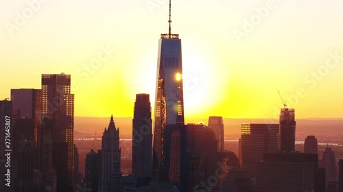 Aerial, sun sets behind One World Trade Center