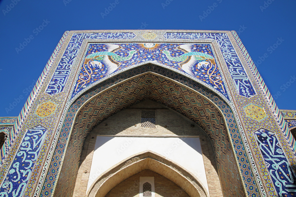 Impressive gate of a madrasa in Bukhara, Uzbekistan