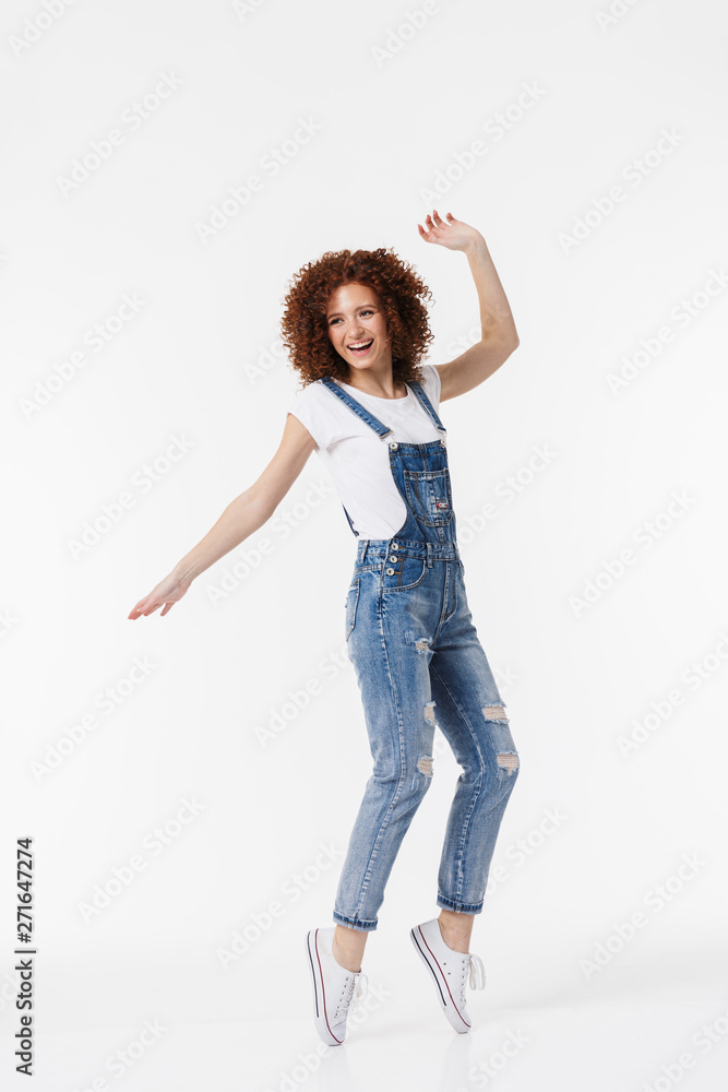 Full length of a cheerful young redhead curly girl Full length of a cheerful young redhead curly girl