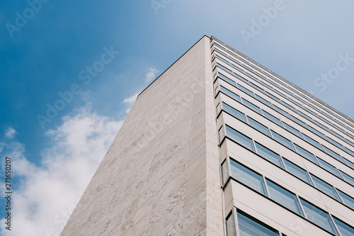 high-rise building and blue sky with soft clouds