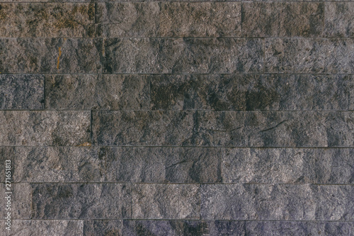 Floor tiles with a grey stone rocky texture     Decorative and ornamental material used for pavement of the streets and alleys or building exteriors