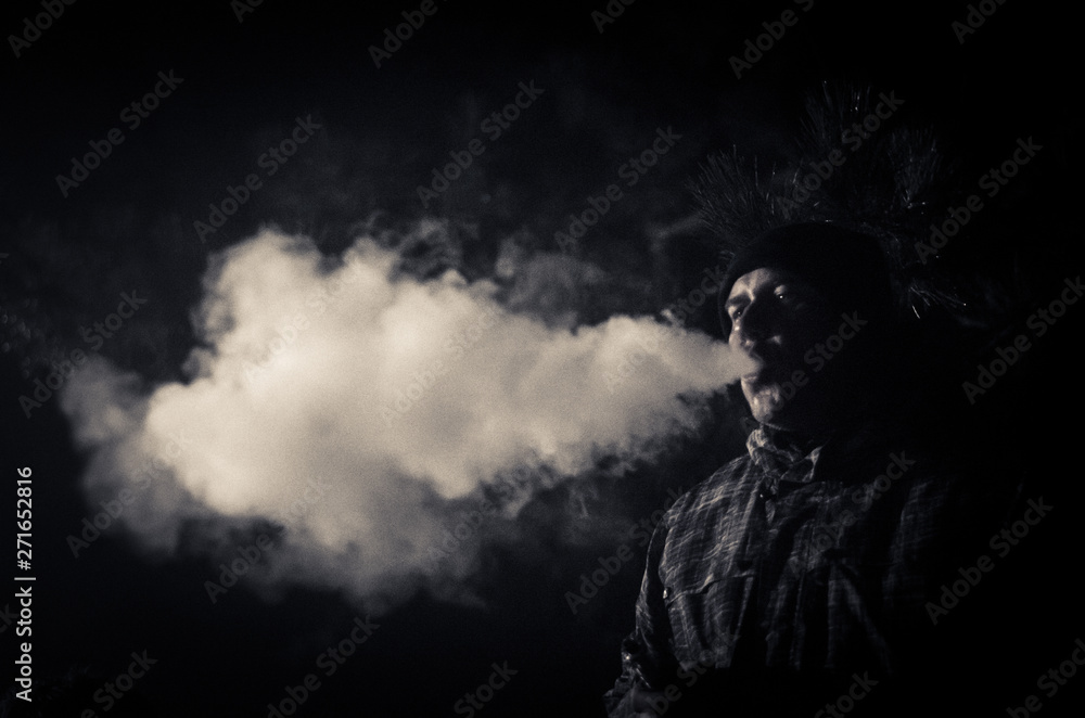 young man smoking a cigarette