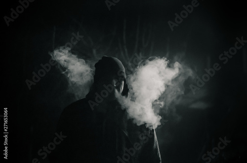 man smoking with a lot of steam
