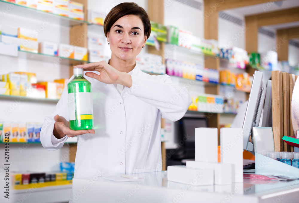 female pharmacist demonstrating assortment of pharmacy