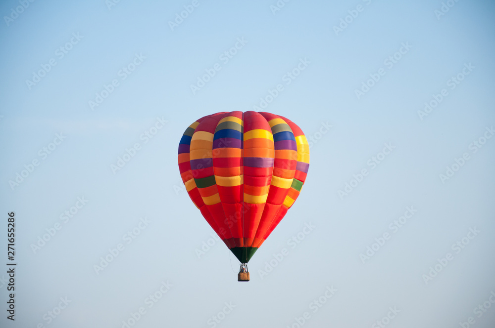 Big balloon. Balloon. Colorful bowl with basket. In the sky soars in the summer Big balloon. Balloon. Colorful bowl with basket. In the sky soars in the summer