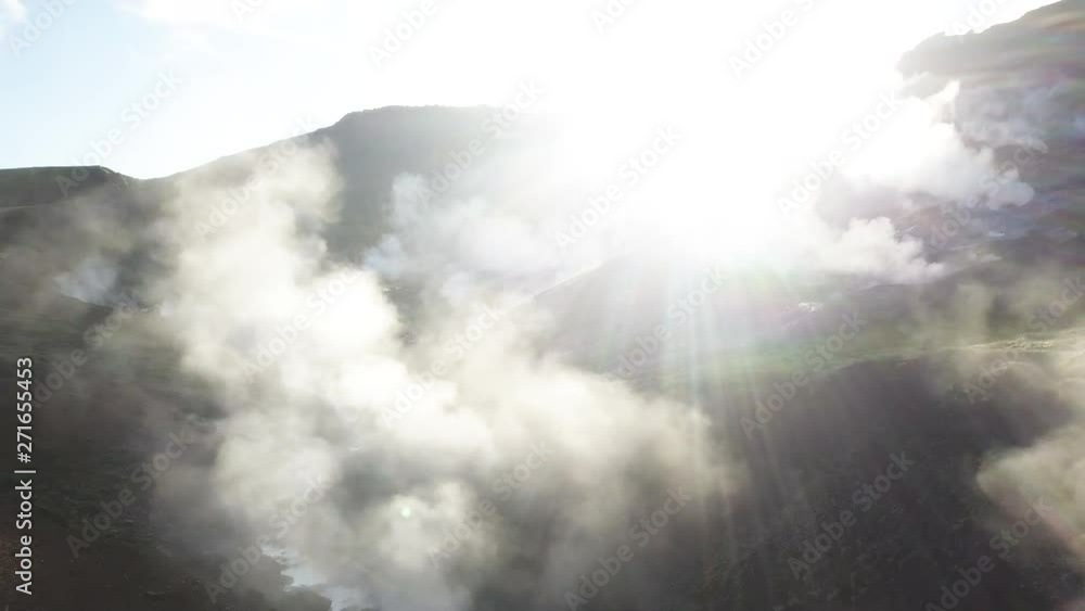 Smokes rises from Reykjadalur thermal river, aerial Smokes rises from Reykjadalur thermal river, aerial